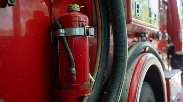 Firemen equipment on fire truck,Fire engine with equipment stay in the fire department. 